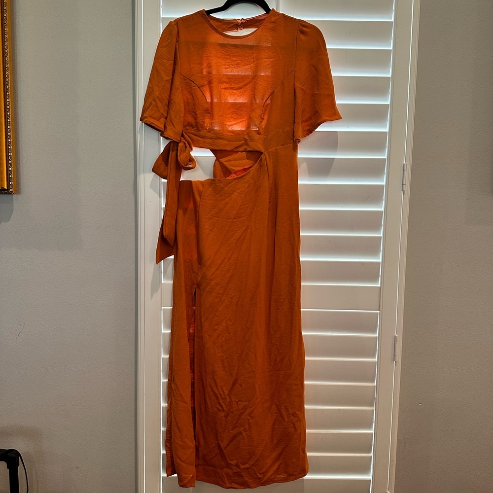 Orange wrap dress. Open back. Short sleeve. Size Large. Brand new, never worn